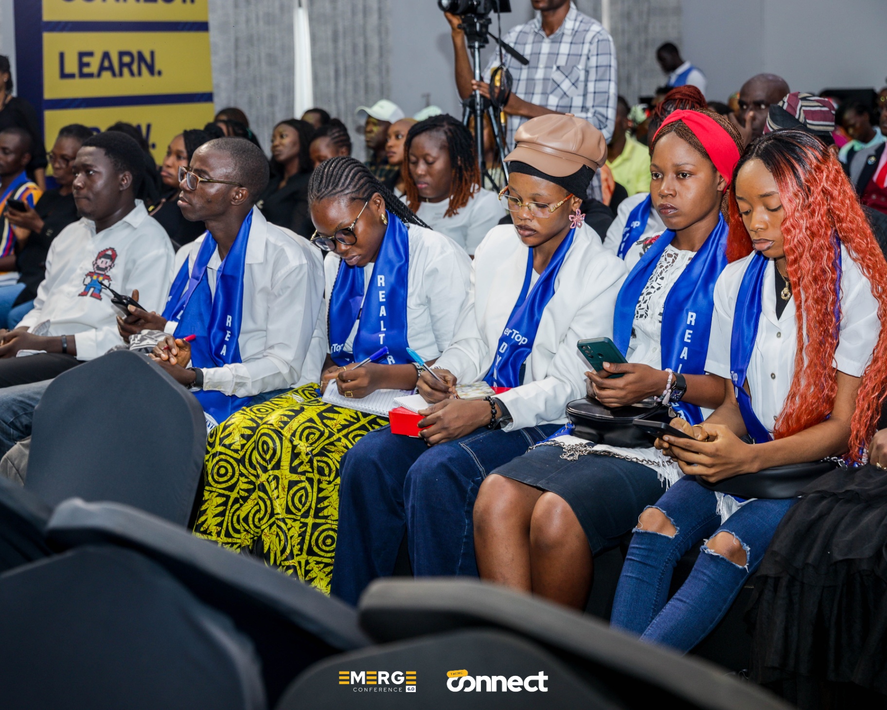 Attendees taking notes during the session