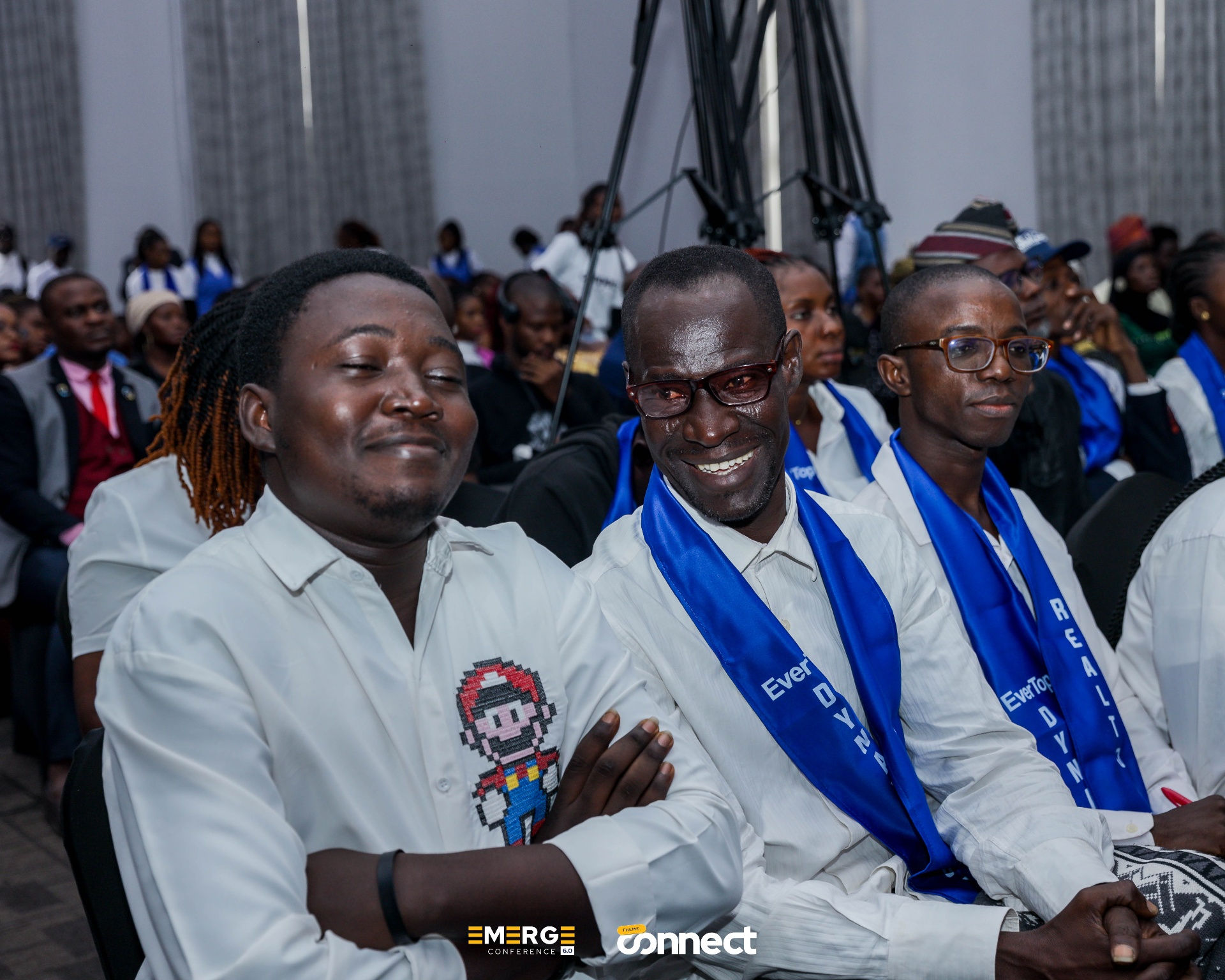 Attendees smiling during the conference